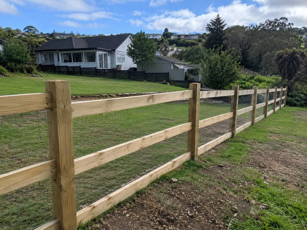 Post and rail fence with stock mesh