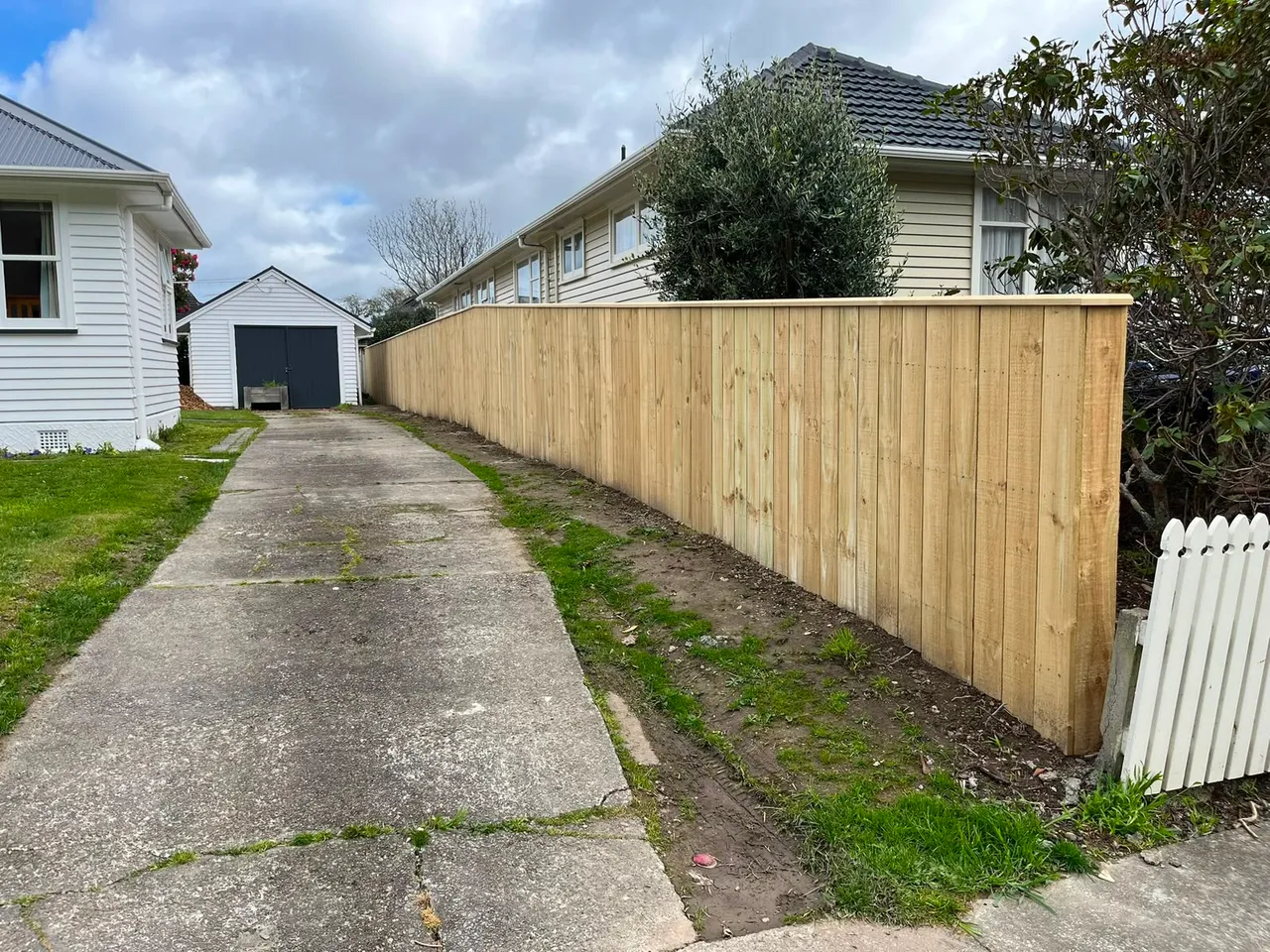 Timber privacy fence along a Wellington driveway