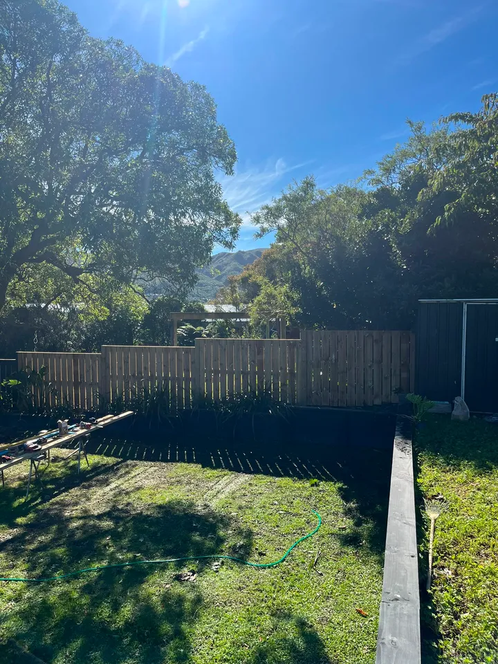 Timber backyard fence framing Wellington hill views