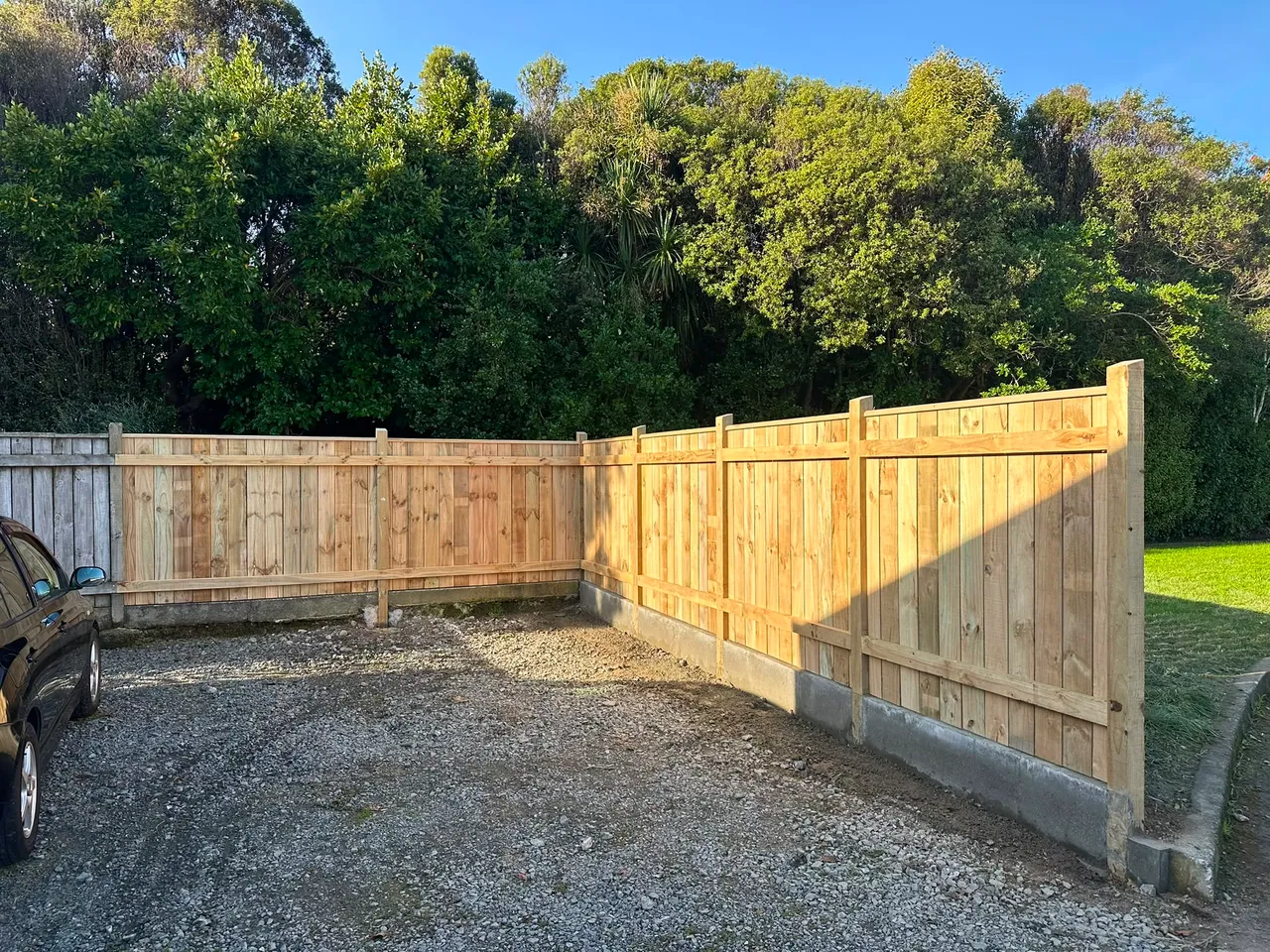 Timber boundary fence enclosing a Wellington gravel yard